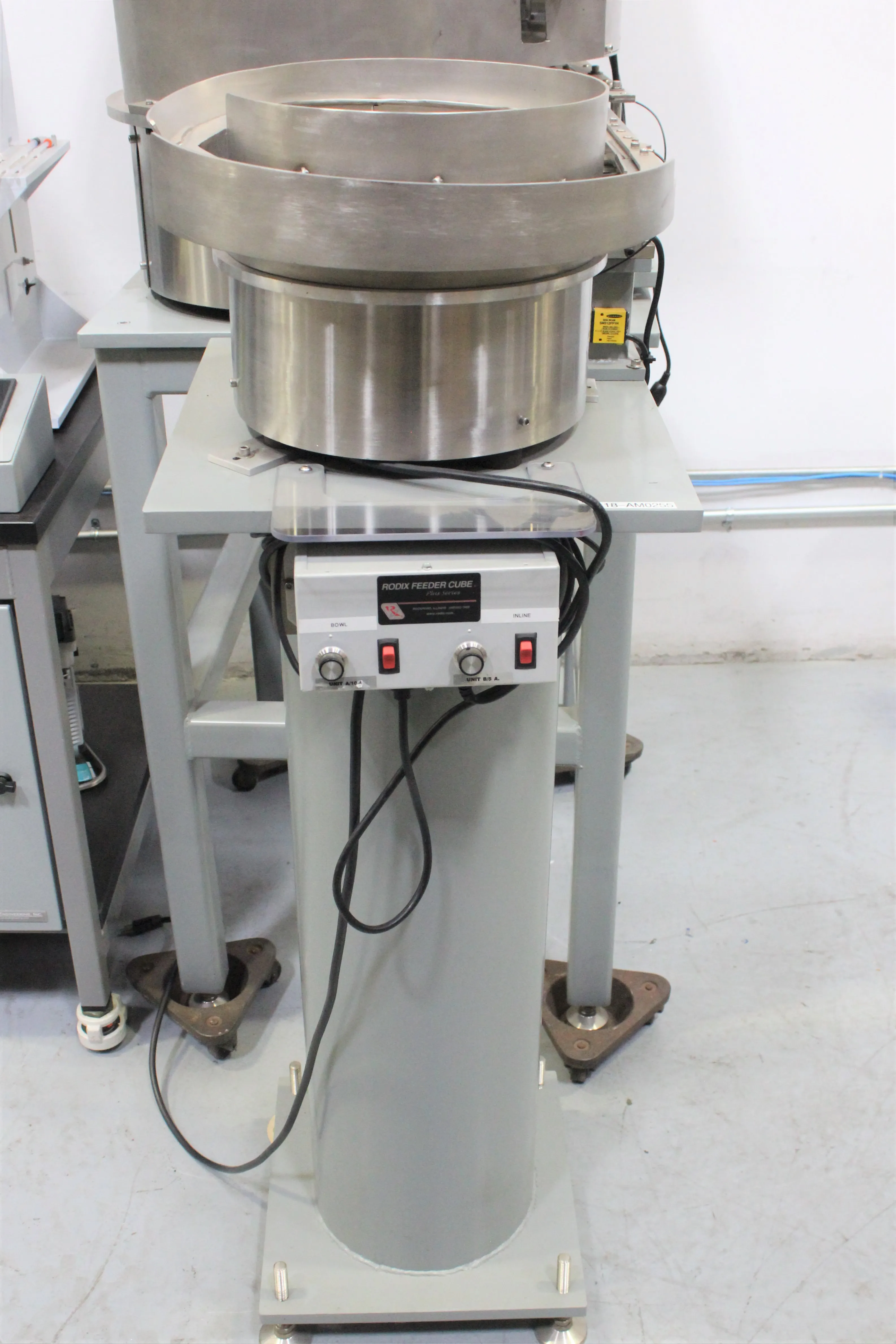 Landry Engineering Syringe Filling Station with TechnaVibes Vibratory Feeders