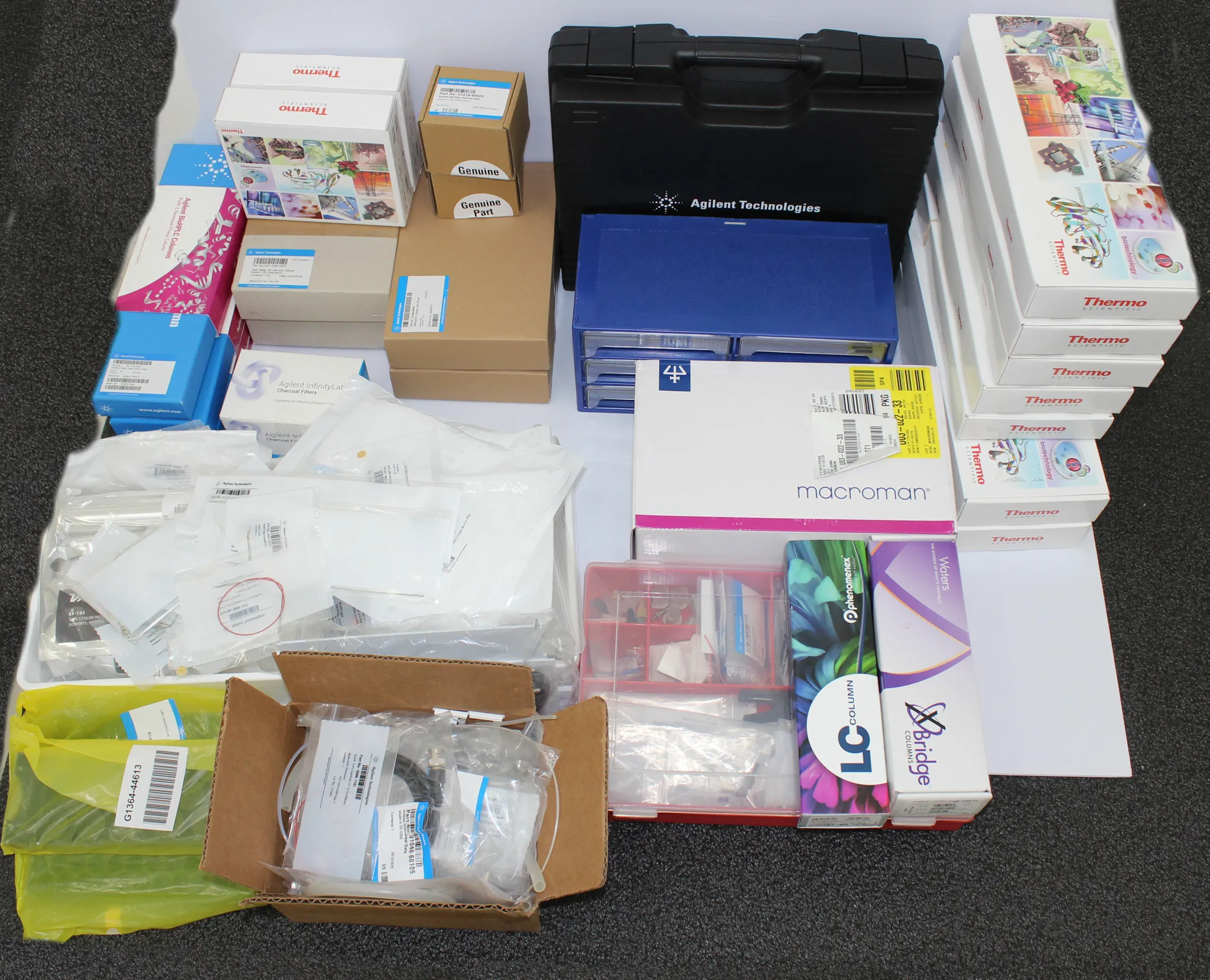 Thermo Scientific Miscellaneous Red Bin with Agilent Accessories, Macroman Pipette Controller, and LC-Tools Box